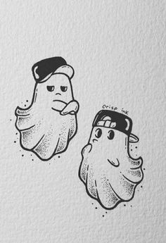 two sea shells with faces drawn on them, one is wearing a hat and the other has