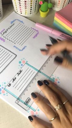 a woman's hand on top of a planner