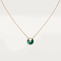 Elevate your style with our AMULETTE MALACHITE NECKLACE! This stunning piece features a beautiful malachite pendant, known for its protective and healing properties. Adorn yourself with this necklace and feel the powerful energy of malachite wherever you go. Embrace the power of nature and add this exquisite necklace to your collection today! ADDITIONAL INFORMATION Color: Gold Stone: Cubic Zirconia Ref. CRB7224543 Material:- 925 Sterling Silver - 18k Gold Plated- 18k Real Gold ( contact us via i Spiritual Malachite Pendant Necklace, Cartier Jewelry With Polished Finish, Green Oval Pendant Amulet Necklace, Luxury Green Malachite Necklace, Luxury Green Pendant Necklace, Luxury Malachite Necklaces For Gifts, Luxury Cartier Gemstone Jewelry, Cartier Luxury Gemstone Jewelry, Green Fine Jewelry Necklace With Polished Finish