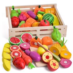 a wooden crate filled with lots of different types of fruits and vegetables