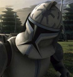 a star wars character sitting on top of a white horse in the middle of a field