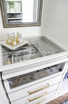 We created a "custom, built-in" master closet look with basic IKEA PAX closet system cabinets simply by adding trim and a few extra touches! Make Up Closet Ideas, Pax Master Closet Ideas, Ikea Pax Closet With Vanity, Ikea Pax Wardrobe System, Ikea Pax Closet Jewelry, Custom Closet Jewelry Storage, Ikea Paxton Closet, Jewelry Armoire In Closet, White And Gold Closet Room