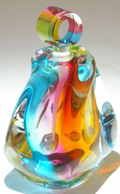 a colorful glass object sitting on top of a table