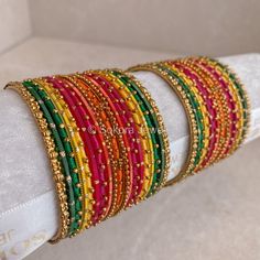 Two small stacks of vibrant coloured bangles on an antique gold base. Sold as 2 arm option only.  Ready to Ship! Colourful Bangles, Bridal Survival Kit, Bangle Box, Hand Harness, Colorful Bangles, Bridal Choker, Bangles Set, The Bangles, Bridal Necklace Set