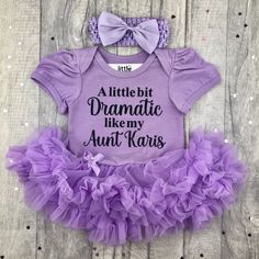 Personalised Funny Aunt Themed Outfit Baby Girls short sleeve cotton soft tutu romper with a matching clip bow and headband - choose the colour tutu romper you would like. Black glitter lettering saying 'A little bit Dramatic like my Aunt (Personalised Name)'. Want to know a bit about who's making your gifts.... We are an award winning family business in the heart of Lancashire. Little Secrets is a British family company, home to the most adorable baby girl and boy outfits and personalised gifts Girl Tutu, Daughters Day, Baby Girl Shorts, Glitter Design, Baby Memories, Funny Outfits, Tutus For Girls, Themed Outfits