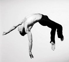 a man flying through the air while riding a skateboard in front of a white background