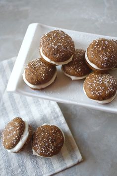 some cookies are sitting on a white plate