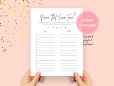 a hand holding up a printable planner with gold confetti on the background