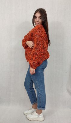 "OVERSIZE Handmade wool cardigan, warm woolen sweater. OVERSIZE warm, handmade, beautiful orange cardigan made of wool and mohair. The sweater has a universal shape and is carefully finished with a drawstring. The sweater is fastened with a safety pin, so you can adjust it accordingly. Sweater dimensions measured flat; width 58 cm length 53 cm The model in the photo is 165 cm tall and wears size M. The cardigan fits women wearing sizes 38 to 42. Design and workmanship by HERMINA  Composition: 50% wool 50% mohair  We recommend hand washing in lukewarm water with a mild liquid. Dry flat in the unfolded position. From time to time, the sweater can be \"bathed\" in cool water with hair conditioner to smooth the fibers and obtain a soft effect. After such treatment, dry as above. Please remembe Hand Knitted V-neck Sweater For Fall, Orange Chunky Knit Sweater For Fall, Burnt Orange Long Sleeve Winter Sweater, Orange Acrylic Winter Sweater, Orange V-neck Knit Sweater, Oversized Orange Winter Cardigan, Oversized Orange Cardigan For Winter, Orange Soft Knit Long Sleeve Sweater, Cozy Orange Winter Cardigan