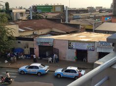 two police cars parked in front of a building