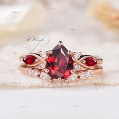 Pear Ruby Engagment Ring Set, Cluster Ring, 2pcs Bridal Set, Unique Wedding Ring, July Ruby Birthstone Ring, Moissanites Weding Band Product Detail Main Ring Material: 10k/14k/18k Solid Rose/White/Yellow Gold Center Stone: 6x8mm Pear Cut Lab Ruby Side Stones: 2x4mm Marquise Cut Lab Ruby & Round Cut Moissanites Wedding Band Material: 10k/14k/18k Solid Rose/White/Yellow Gold Gemstones: 1.5x3mm Marquise Cut & Round Cut Moissanites Custom Service 1, Gemstones can be replaced with others. 2, All meta Gap Wedding Band, Ruby Birthstone Ring, Ruby Engagement Ring Set, Ruby Ring Set, Ruby Wedding Band, Pear Wedding Ring, Pretty Engagement Rings, Silver Rose Ring, Cute Engagement Rings