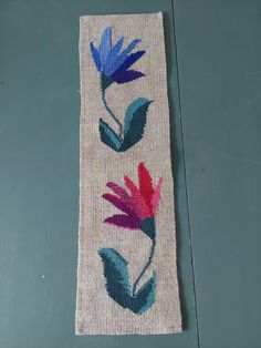 a piece of cloth with colorful flowers on it