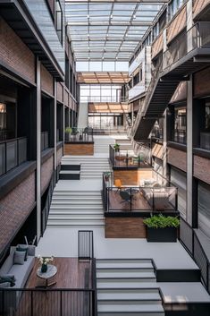 an indoor courtyard with stairs and seating area