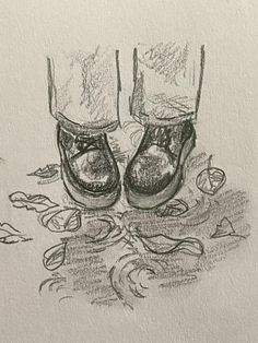 a drawing of two pairs of shoes on the ground