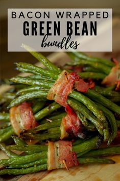 bacon wrapped green bean bundles on a cutting board with text overlay that reads bacon wrapped green bean bundles