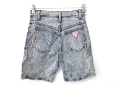 "Vintage 80's Banda Macho graphic denim acid wash shorts. Fitted and stretchy cut with faux leather graphics. Every garment we sell is authentic vintage and one-of-a-kind! You will receive the exact item photographed. Condition: Very good vintage. Best fits women's: Labelled 5/6 Extra small Material: denim MEASUREMENTS Taken from seam to seam while the garment is lying flat. Double the armpit, waist, and hips Waist 24\" Waist to hem 17\" Hips 16.5\" Crotch to waist 11.5\" Leg opening 9\"" Acid Wash Shorts For Summer Streetwear, Acid Wash Retro Bottoms For Summer, Summer Acid Wash Shorts For Streetwear, Acid Wash Retro Summer Bottoms, 90s Acid Wash Bottoms For Summer, Acid Wash 90s Style Summer Bottoms, Acid Wash Summer Bottoms In 90s Style, 90s Style Fitted Shorts For Streetwear, Fitted Medium Wash Shorts For Streetwear