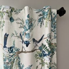 a curtain with blue and green birds on it