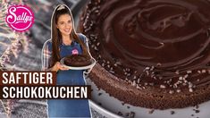 a woman holding a chocolate cake on top of a white plate with the words saffiger schokokuchen