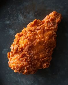 fried chicken on a black plate ready to be eaten