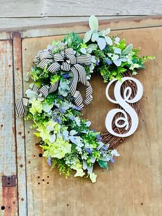 a wreath with the letter s on it