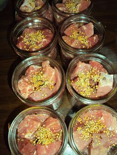 several jars filled with food sitting on top of a table