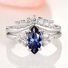 Gorgeous Vintage Inspired Marquise Royal Blue Sapphire Ring. Can be purchased with or without stacking band/wedding band. Select desired style option from the drop-down menu. ►Made of solid 925 sterling silver with rhodium finish ►Average band width: 1.6 mm (each ring)Center Stone: SapphireColor: Royal BlueShape: Marqu Royal Blue Sapphire Ring, Sapphire Promise Rings, Sapphire Engagement Rings, Popular Engagement Rings, Blue Sapphire Ring, Sapphire Color, Wedding Ring Designs, Creating Jewelry, Bridal Ring Set