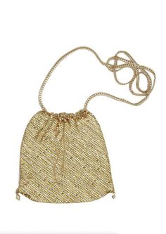 Make a chic fashion statement with the Gold Shimmer Pouch with Gold Shoulder Chain! Shinny gold and glass crystals shape this bold crossbody bag featuring a pouch design. Open adjustable drawstrings open up this cute little pouch that's perfect for storing your cell phone and lipstick! Carry by the gold chain strap or wear as a crossbody. DETAILS & CARE Gold tone plated. Glass crystals. Chain strap length: 40 Inches. Pouch height: 6.5 Inches, width: 6 inches. Drawstring chain closure.