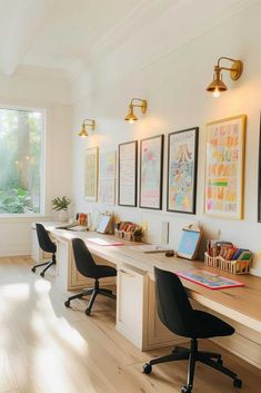 an office with two desks and chairs in front of large windows on the wall