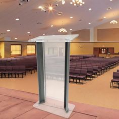 an empty room with rows of chairs and a podium on the floor in front of it