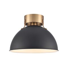 a black and gold light fixture on a white background, with the light turned off