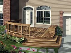 an artist's rendering of a wooden deck in front of a house with two garage doors