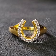 a gold ring with diamonds on it