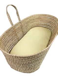 an empty wicker basket with a pillow in the bottom and side view on a white background