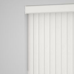 a white window with vertical blinds on it