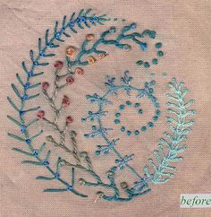 the embroidery design is done with blue thread and beads on white fabric, which has been stitched together