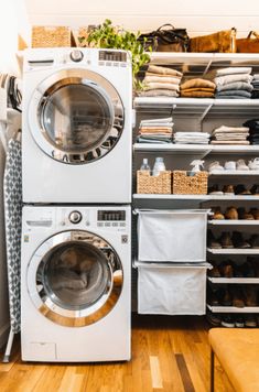 a washer and dryer stacked on top of each other in a laundry room