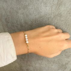 A real pearl bracelet with genuine pearls and 925 sterling silver. If you are looking for Christmas Gifts or bridesmaid gifts this pearl boho bracelet is a great idea. You will love to wear it every day! This dainty boho bracelet adds a sparkling shine to your look!  Ideal for a wedding day as wedding jewelry!❤️️❤️️ 👉Handmade with love in Greece! Material  ✔️Pearl original gemstone ✔️Gold-filled  925 sterling silver      >>IS IT A GIFT?❤️️ This dainty bracelet comes in a beautiful gift box. If Adjustable Pearl Bracelet For Anniversary, Adjustable Pearl Chain Bracelet For Anniversary, Elegant Pearl Bracelet With Extender As Gift, Elegant Pearl Bracelet With Extender For Gift, Minimalist Pearl Bracelet For Anniversary With Pearl Chain, Anniversary Beaded Bracelets With Pearl Chain, Adjustable Pearl Drop Bracelet As Gift, Adjustable Pearl Drop Bracelet For Gift, Beaded Bracelets With Pearl Charm For Gift