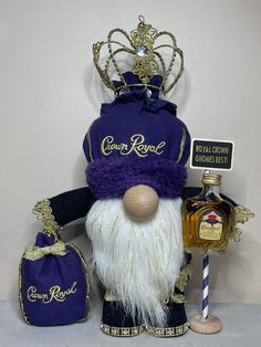 a purple and white gnome figurine with a crown on it's head