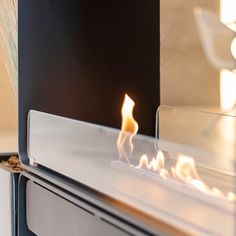 a close up of a fire burning in a fireplace