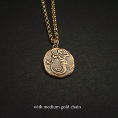 Handmade Greek coin reproduction of merman Triton, son of Poseidon necklace. Triton, son of Poseidon and Aphrodite, striking downward with a trident and holding fish. Triton is the messenger of the big sea. Like his father he carried a trident, but his special attribute was a twisted conch shell on which he blew to clam or raise the waves. - Handmade charm. - Solid yellow bronze also called jewelry gold bronze coin. - Nickel free - 14k gold filled chain - Gold filled has 100 times more gold than Mythological Style Gold Coin Pendant Jewelry, Gold Mythological Coin Pendant Jewelry, Gold Mythological Jewelry With Coin Pendant, Bronze Coin Amulet Necklaces, Ancient Brass Necklace With Coin Pendant, Ancient Style Brass Necklace With Coin Pendant, Ancient Bronze Necklace With Coin Pendant, Ancient Style Bronze Necklace With Coin Pendant, Bronze Medallion Necklace With Coin Pendant As Gift