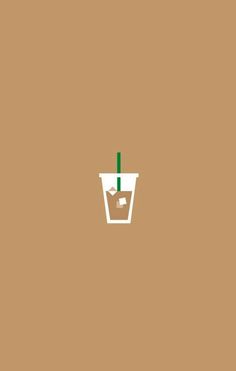 a cup with a green straw sticking out of it's side on a brown background