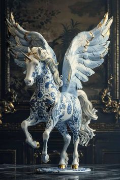 a blue and white horse with wings on it's back