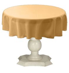 a round table covered with a tan cloth on top of a white pedestal and base