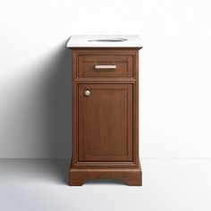 a small wooden cabinet with a sink on it's side and a white wall behind it