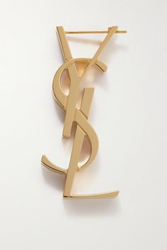 Designed by graphic artist Cassandre, also known as Adolphe Jean Marie Mouron, SAINT LAURENT's interlocking logo has been synonymous with the house since its debut in 1961. This gold-tone earring is cast in the shape of the iconic monogram and polished to a glowing finish. Style yours solo, with a complementary stud in the opposite ear. Ysl Earrings, Notes Design, Logo Collection, Fashion Jewelry Earrings, Style Crush, Single Earring, Graphic Artist, Designer Earrings, Net A Porter