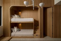 a bunk bed in a room with wooden walls