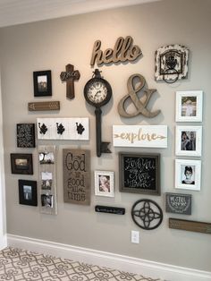 a wall with many different pictures and clocks on it