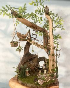 a miniature tree house made out of wood