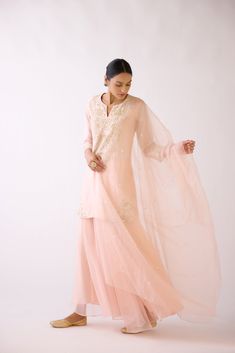 Stunning baby pink embroidered cotton silk sharara suit is a perfect festive wear. It comes with a matching dupatta. Shop online from Pure Elegance. Disclaimer: The actual product may vary slightly from the image. These are custom orders, hence expect slight variation in color and placement of the motif or buta. ESTIMATED DELIVERYBecause this is a custom order, it would take about 4 weeks from the date of purchase. RETURN POLICYThis product is a custom order and cannot be returned or exchanged. Unstitched Pink Sharara For Celebration, Pink Chanderi Sharara For Celebration, Pink Organza Sharara With Sheer Dupatta, Pink Salwar Kameez For Eid Celebration, Pink Organza Salwar Kameez With Straight Kurta, Pink Salwar Kameez With Zari Work For Celebration, Pink Unstitched Lehenga For Celebrations, Pink Chanderi Churidar For Celebration, Semi-stitched Pink Palazzo Set For Celebration