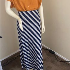 Navy Blue & Gray Stripped Maxi Skirt. Brand New With Tags. 95% Rayon 5% Spandex. Blue Fitted Casual Maxi Skirt, Casual Blue Stretch Maxi Skirt, Fitted Striped Maxi Skirt For Spring, Casual Striped Long Skirt, Casual Striped Stretch Skirt, Casual Striped Mini Skirt, Casual Striped Flowy Bottoms, Casual Striped Skirt, Casual Striped Skirt For Day Out